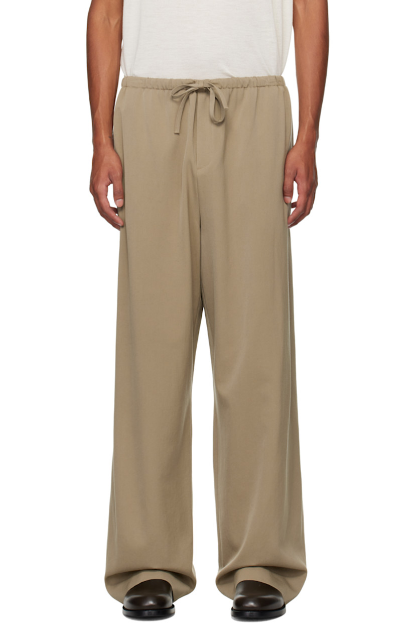 Wool grain de poudre trousers.

· Mid-rise
· Drawstring at elasticized waistband
· Three-pocket styling
· Zip-fly

Supplier color: Grey taupe