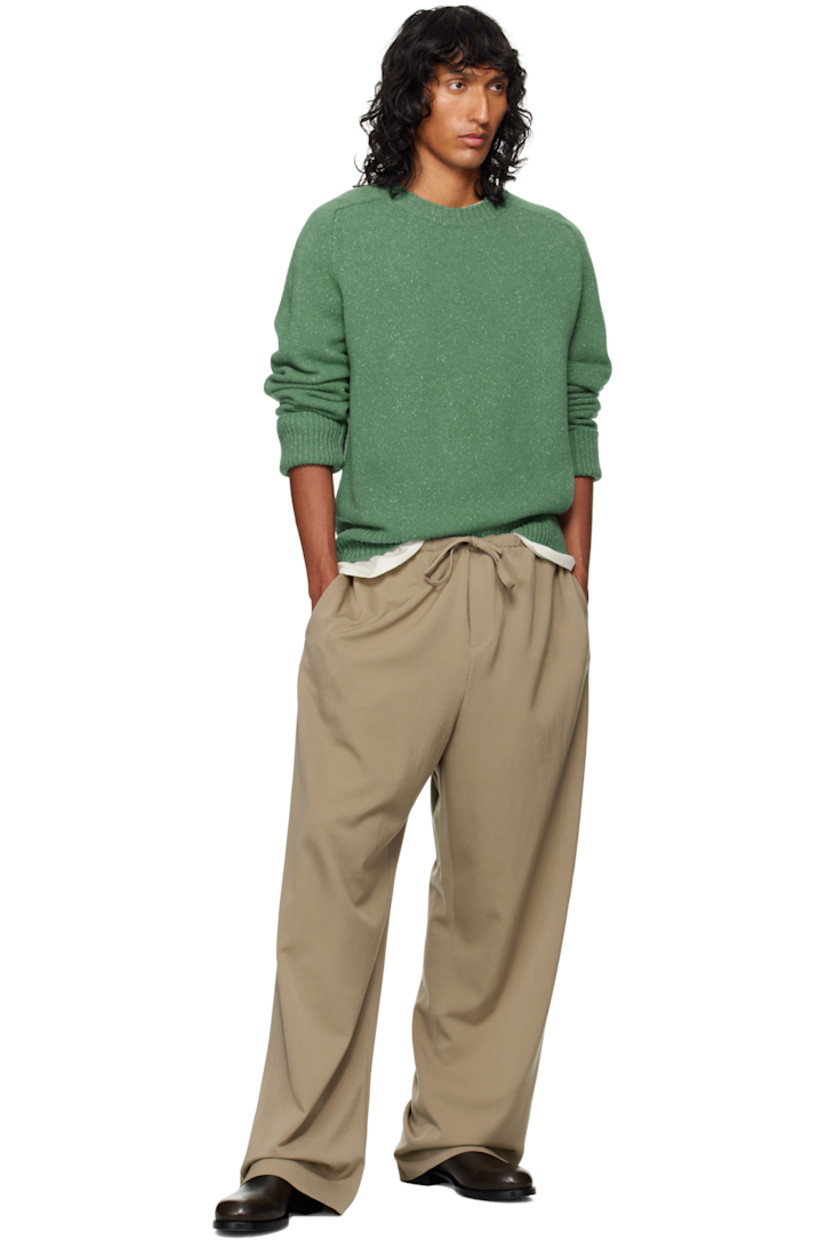 Wool grain de poudre trousers.

· Mid-rise
· Drawstring at elasticized waistband
· Three-pocket styling
· Zip-fly

Supplier color: Grey taupe