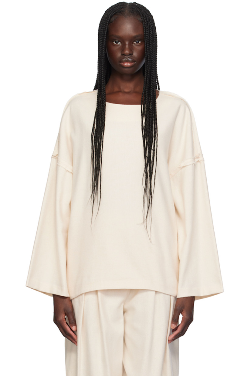 Cotton herringbone blouse. Inverted seams with frayed edges throughout.

· Round neck
· Curved hem
· Dropped shoulders

Supplier color: Ivory