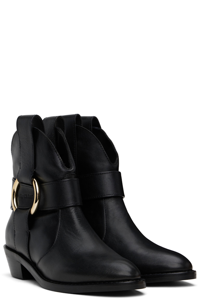 Ankle-high buffed leather boots in black. 

· Pointed toe
· Pull-loops at collar 
· Embossed logo and O-ring at outer side
· Stacked leather heel
· Rubber sole
· Gold-tone hardware
· Heel: H1.5"

Supplier color: Black