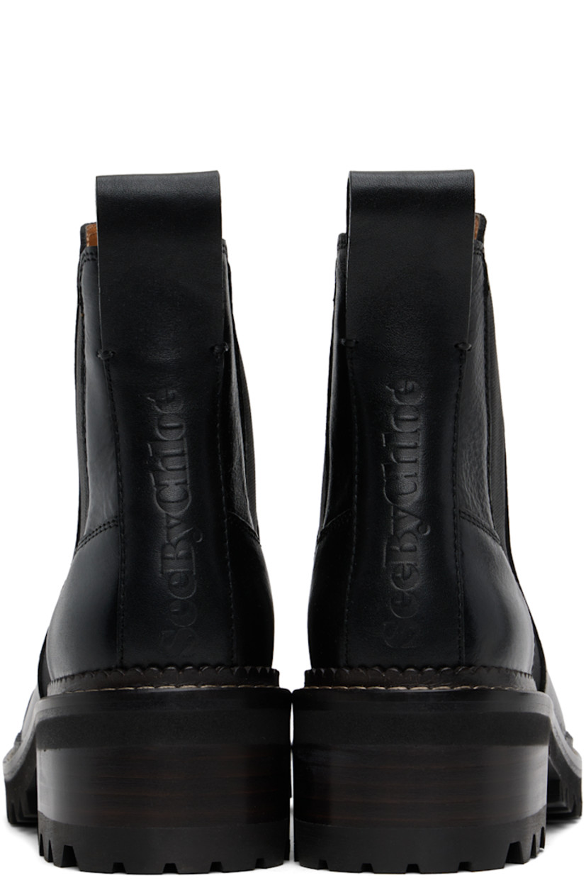 Ankle-high grained leather boots in black. 

· Cap toe
· Elasticized gusset at sides
· Pull-loop at heel tab
· Logo embossed at heel counter
· Stacked leather block heel
· Scalloped detailing and topstitching at welt
· Treaded rubber sole 
· Heel: H2"

Supplier color: Black