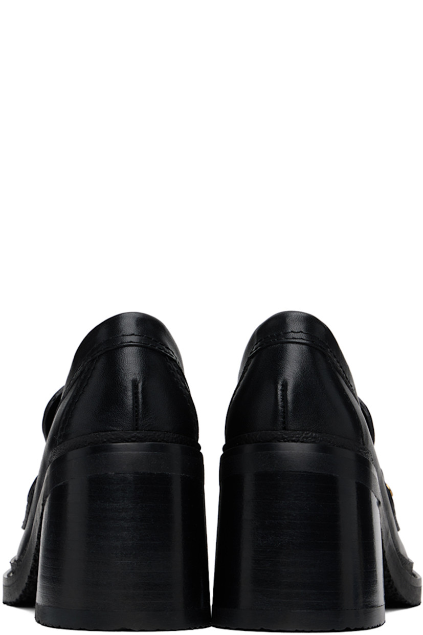 Buffed leather loafer-style heels in black. 

· Moc toe
· Logo plaque and strap at vamp
· Logo embossed at padded footbed
· Stacked leather block heel with rubber injection
· Crepe rubber sole
· Heel: H3"

Supplier color: Black