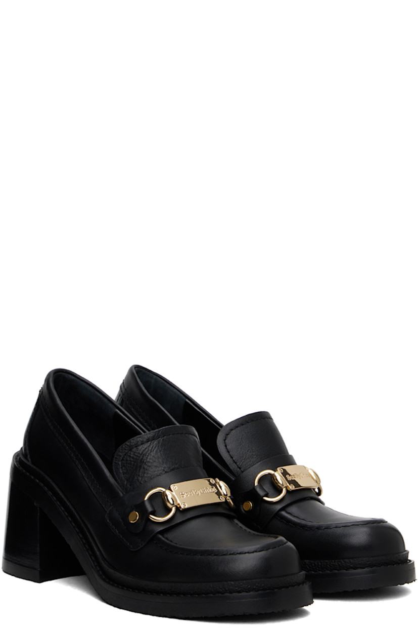 Buffed leather loafer-style heels in black. 

· Moc toe
· Logo plaque and strap at vamp
· Logo embossed at padded footbed
· Stacked leather block heel with rubber injection
· Crepe rubber sole
· Heel: H3"

Supplier color: Black