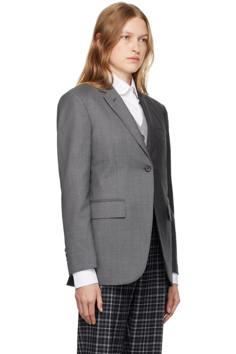 Wool twill blazer.

· Notched lapel
· Button closure
· Welt pocket at chest
· Flap pockets
· Padded shoulders
· Four-button surgeon's cuffs
· Tricolor grosgrain flag at back collar 
· Twin vents at back hem
· Tricolor grosgrain button tab at interior
· Welt pockets
· Full tricolor cupro satin lining 

Supplier color: Medium grey