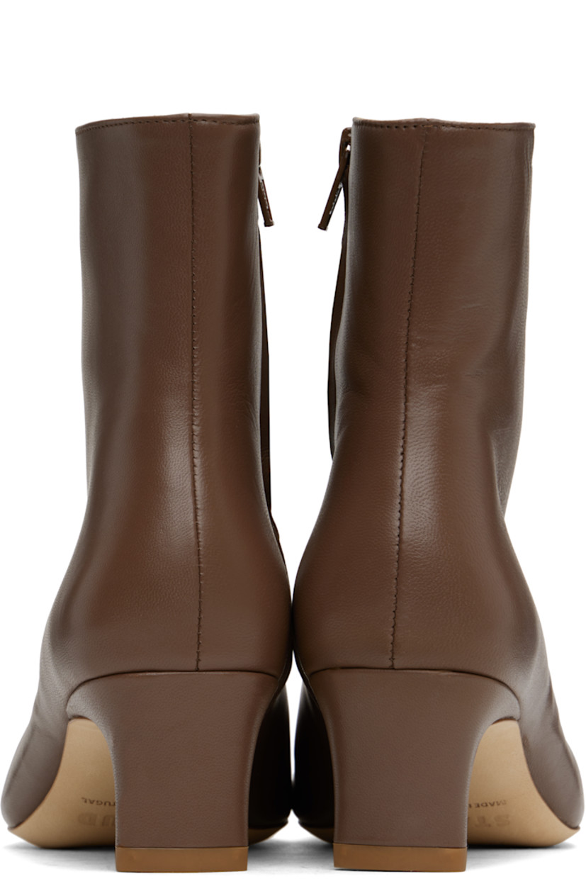Ankle-high buffed lambskin boots in brown.

· Pointed square toe
· Zip closure at inner side
· Buffed leather lining
· Curved block heel with rubber injection
· Suede sole
· Heel: H2"

Supplier color: Cacao
