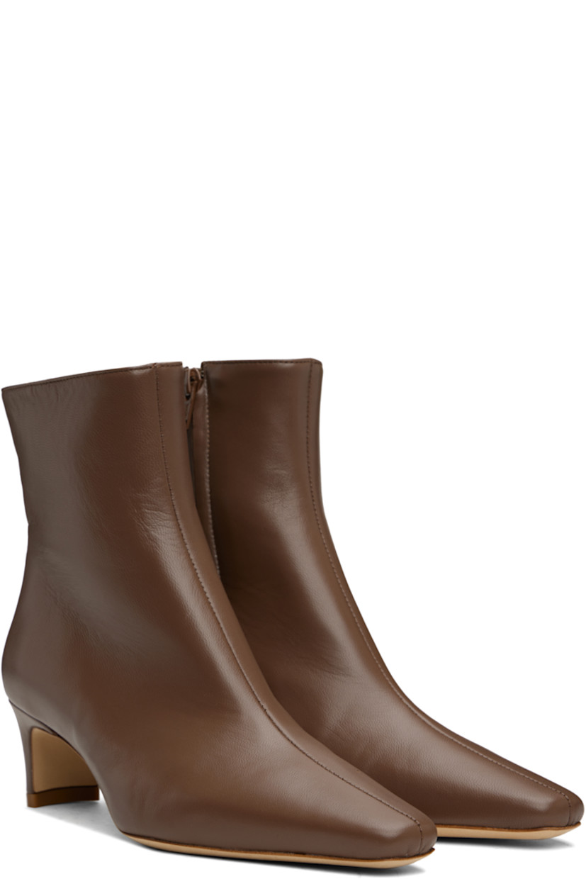 Ankle-high buffed lambskin boots in brown.

· Pointed square toe
· Zip closure at inner side
· Buffed leather lining
· Curved block heel with rubber injection
· Suede sole
· Heel: H2"

Supplier color: Cacao