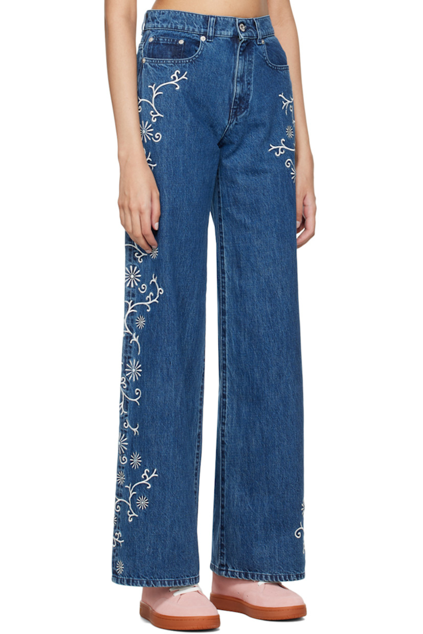 Wide-leg non-stretch Japanese denim jeans. Fading and floral pattern embroidered throughout.

· High rise 
· Belt loops
· Five-pocket styling
· Zip-fly 
· Jacron logo patch at back waistband 
· Silver-tone logo-engraved hardware
