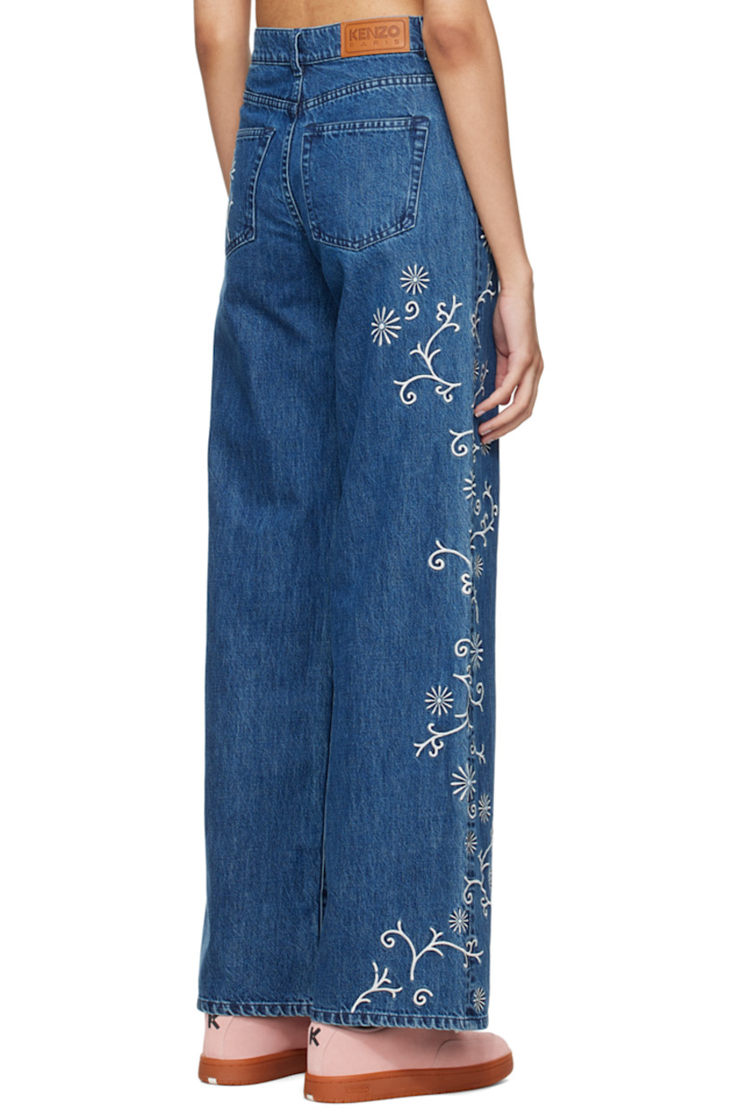 Wide-leg non-stretch Japanese denim jeans. Fading and floral pattern embroidered throughout.

· High rise 
· Belt loops
· Five-pocket styling
· Zip-fly 
· Jacron logo patch at back waistband 
· Silver-tone logo-engraved hardware