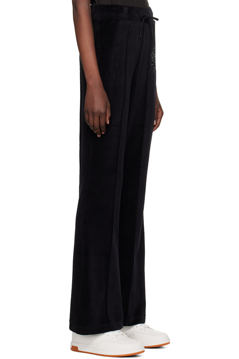 Cotton-blend velour track pants.

· Drawstring at elasticized waistband
· Two-pocket styling
· Logo graphic embroidered at front
· Pinched seam at front and back

Supplier color: Black