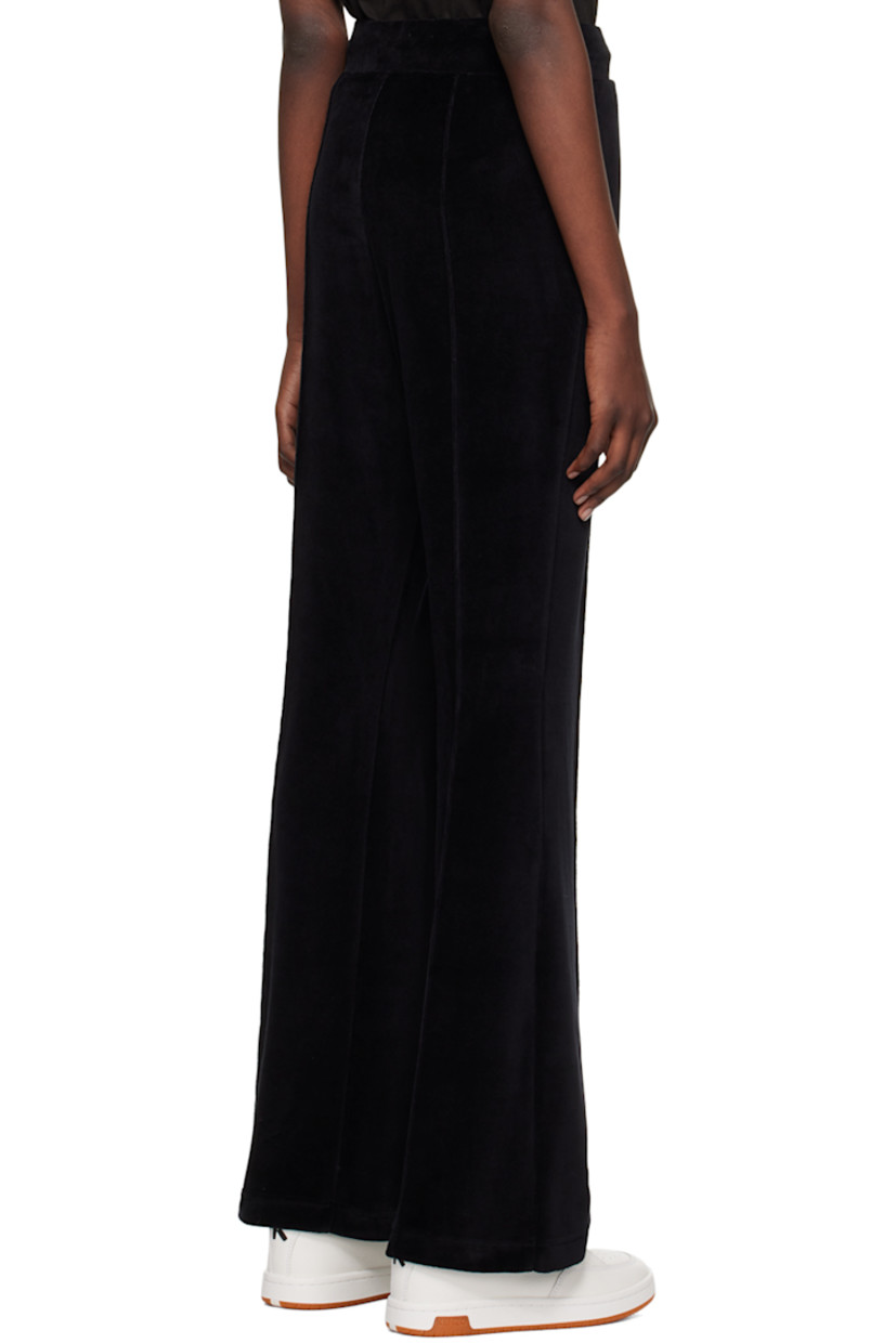 Cotton-blend velour track pants.

· Drawstring at elasticized waistband
· Two-pocket styling
· Logo graphic embroidered at front
· Pinched seam at front and back

Supplier color: Black