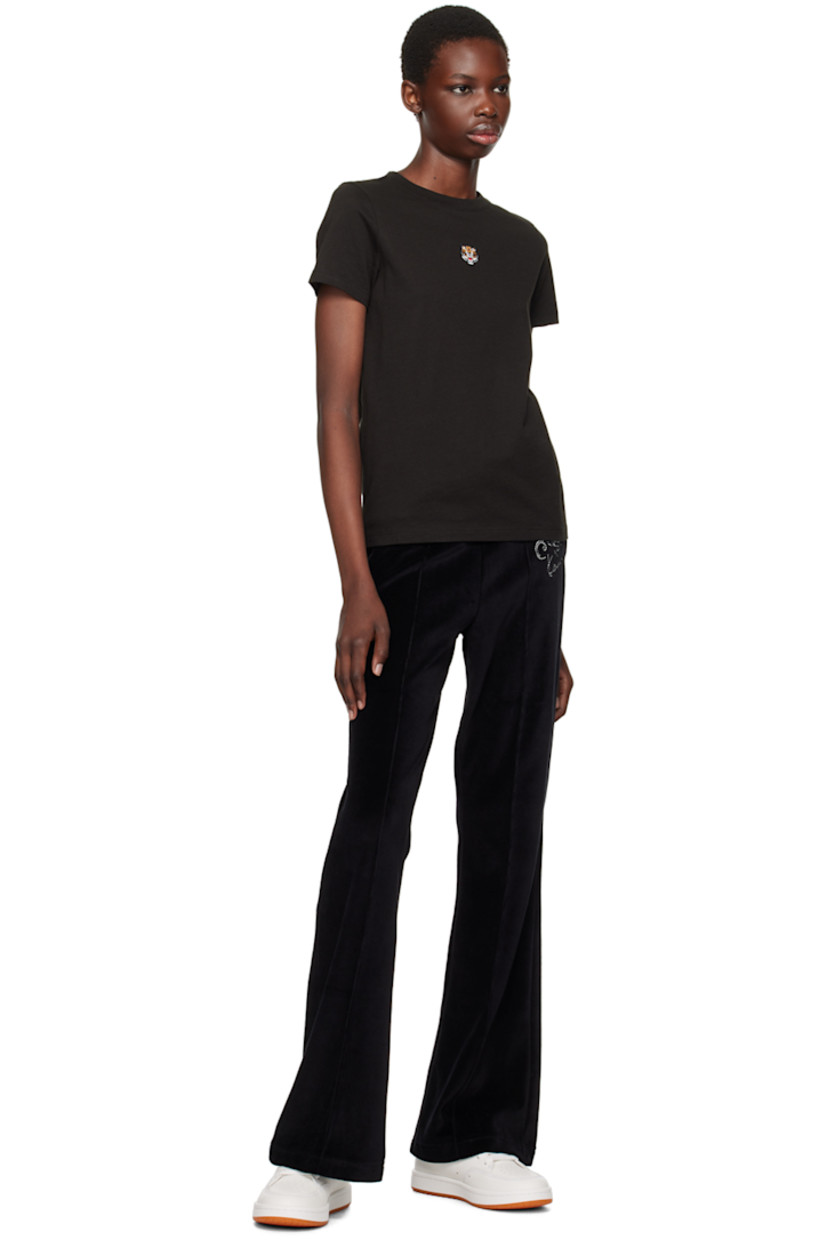 Cotton-blend velour track pants.

· Drawstring at elasticized waistband
· Two-pocket styling
· Logo graphic embroidered at front
· Pinched seam at front and back

Supplier color: Black