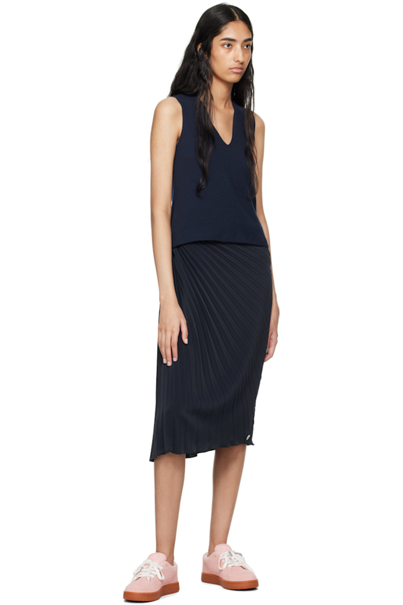 Polyester crepe skirt. Pleats and gathering throughout. 

· Cutout at waistband 
· Logo plaque at hem 
· Concealed zip closure at side seam 

Supplier color: Blue black