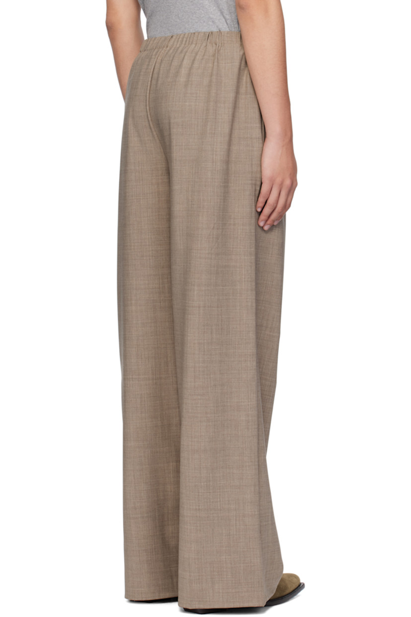Stretch wool- and recycled polyester-blend canvas trousers.

· Elasticized waistband
· Two-pocket styling
· Mock-fly

Supplier color: Beige