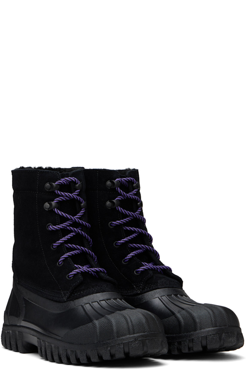 Handcrafted ankle-high suede boots in black.

· Lace-up closure
· Logo embossed at padded tongue
· Padded collar
· Logo graphic embossed at outer side
· Pull-loop at heel
· Extended rubber welt
· Shearling lining
· Lugged rubber sole
· Heel: H1.25"

Supplier color: Black