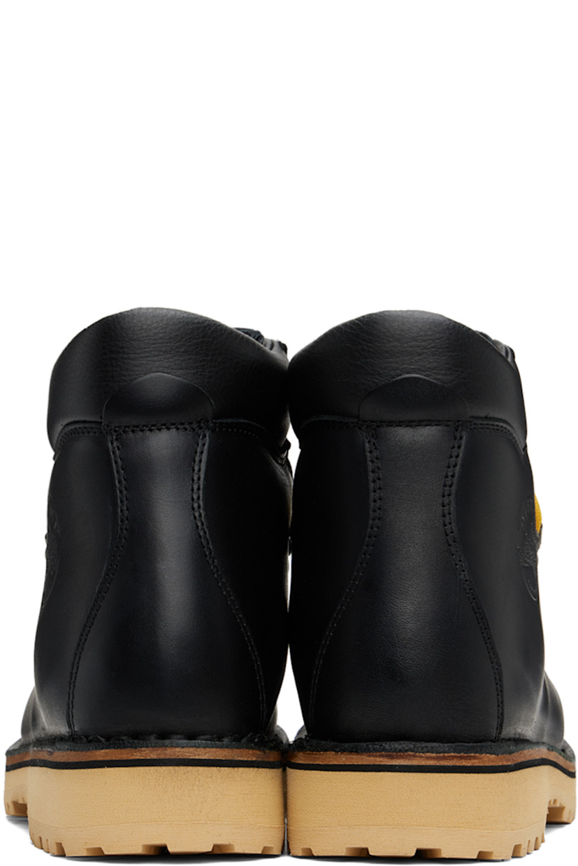 Ankle-high grained leather boots in black.

· Lace-up closure
· Logo embossed at padded tongue
· Padded collar
· Logo graphic embossed at outer side
· Nappa leather lining
· Topstitching at welt 
· Foam rubber midsole
· Lugged rubber sole
· Heel: H1.25"

Supplier color: Black leather
