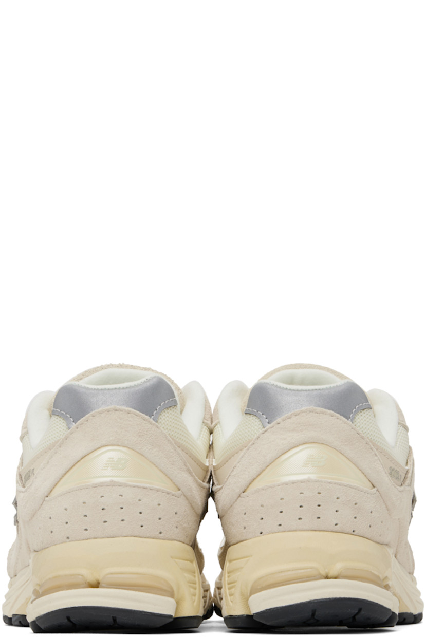 Low-top pigskin nubuck and mesh sneakers in taupe.

· Lace-up closure
· Rubberized logo patch at padded tongue
· Padded collar
· Perforated detailing at heel counter
· Logo appliqué at sides
· Jersey lining
· ABZORB® foam rubber midsole
· Stability Web technology
· Treaded N-ergy rubber sole

Supplier color: Calm taupe/Angora/Silver metallic