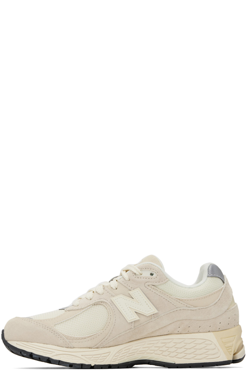 Low-top pigskin nubuck and mesh sneakers in taupe.

· Lace-up closure
· Rubberized logo patch at padded tongue
· Padded collar
· Perforated detailing at heel counter
· Logo appliqué at sides
· Jersey lining
· ABZORB® foam rubber midsole
· Stability Web technology
· Treaded N-ergy rubber sole

Supplier color: Calm taupe/Angora/Silver metallic