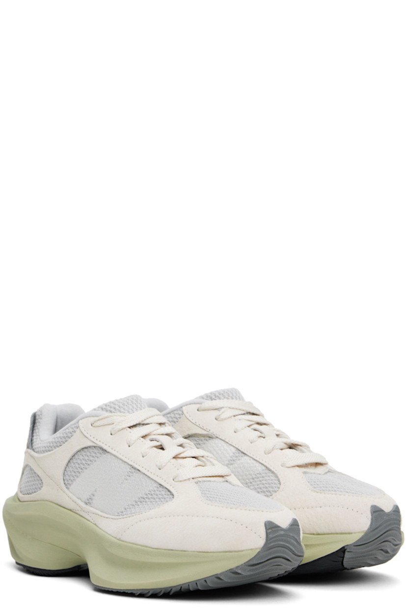 Low-top knit and pigskin suede sneakers in beige and gray.

· Lace-up closure
· Padded tongue and collar
· Logo bonded at sides
· Fleece lining
· Sculptural FuelCell foam rubber platform midsole
· Treaded rubber sole
· Platform: H2"

Supplier color: Linen/Brighton grey/Olivine