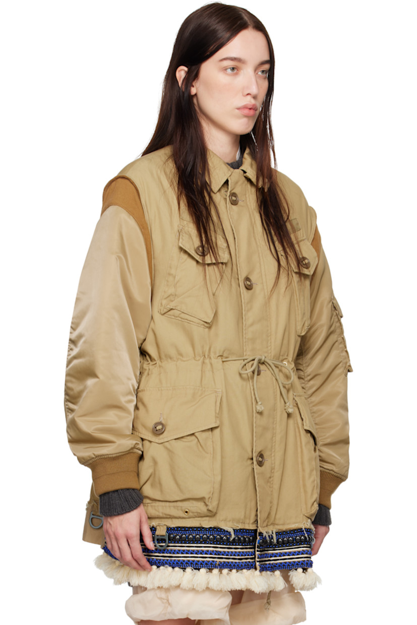 Cotton-blend plain-woven bomber jacket.

· Spread collar
· Button closure
· Flap pockets at front and sleeve
· Drawstring at waist
· Beaded trim with fringe detailing at hem
· Rib-knit at armscyes and cuffs
· Welt pockets at interior
· Fully lined

Supplier color: Beige