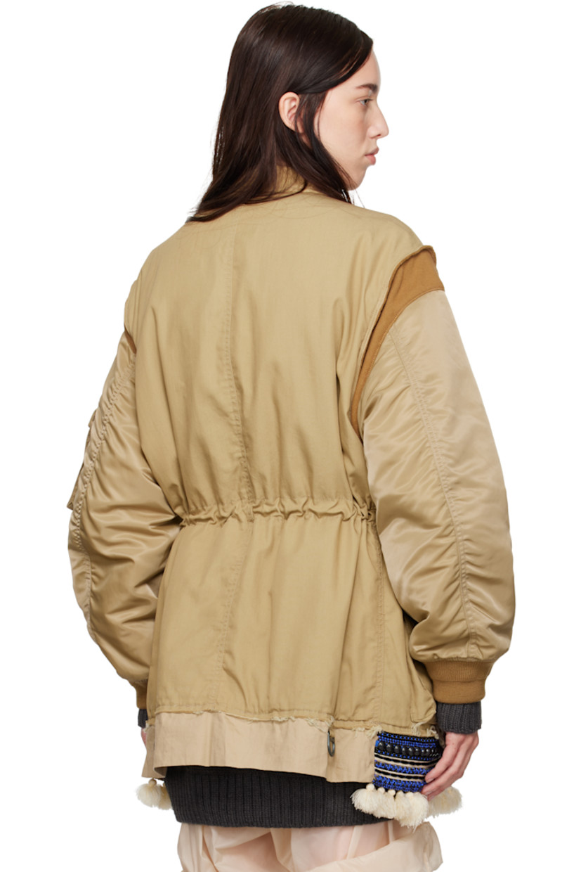 Cotton-blend plain-woven bomber jacket.

· Spread collar
· Button closure
· Flap pockets at front and sleeve
· Drawstring at waist
· Beaded trim with fringe detailing at hem
· Rib-knit at armscyes and cuffs
· Welt pockets at interior
· Fully lined

Supplier color: Beige