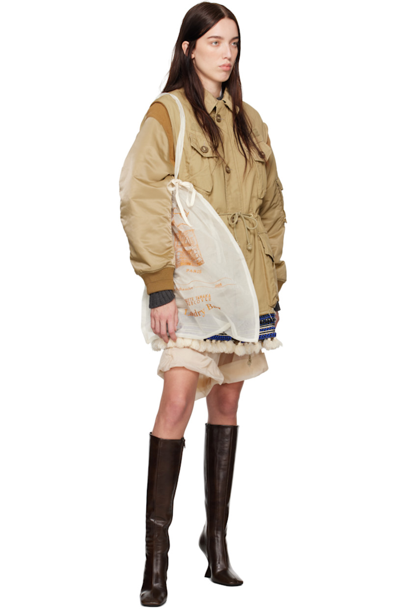 Cotton-blend plain-woven bomber jacket.

· Spread collar
· Button closure
· Flap pockets at front and sleeve
· Drawstring at waist
· Beaded trim with fringe detailing at hem
· Rib-knit at armscyes and cuffs
· Welt pockets at interior
· Fully lined

Supplier color: Beige