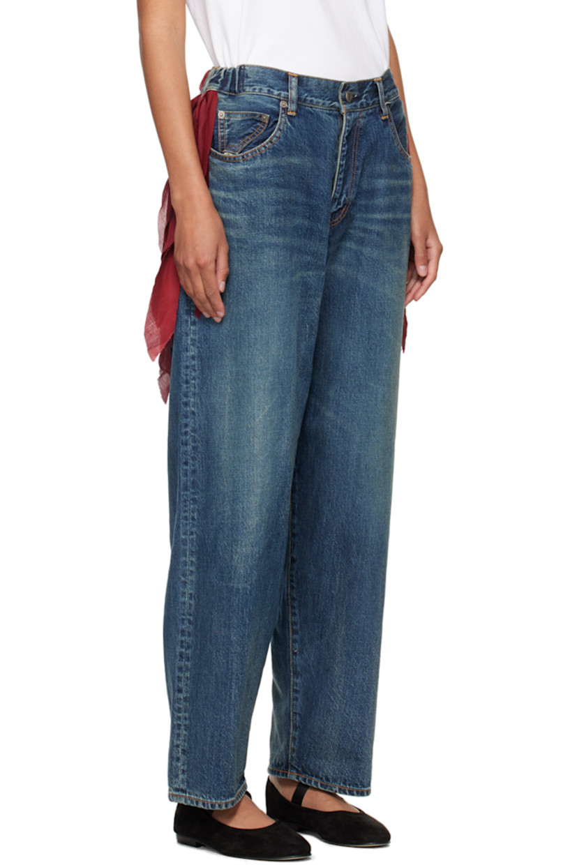 Non-stretch denim jeans. Fading, whiskering and subtle distressing throughout. 

· Belt loops at partially elasticized waistband
· Fringed trim at waist
· Five-pocket styling 
· Zip-fly
· Logo flag at back pocket
· Contrast stitching in tan 

Supplier color: Light blue indigo