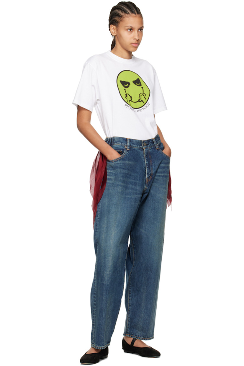 Non-stretch denim jeans. Fading, whiskering and subtle distressing throughout. 

· Belt loops at partially elasticized waistband
· Fringed trim at waist
· Five-pocket styling 
· Zip-fly
· Logo flag at back pocket
· Contrast stitching in tan 

Supplier color: Light blue indigo
