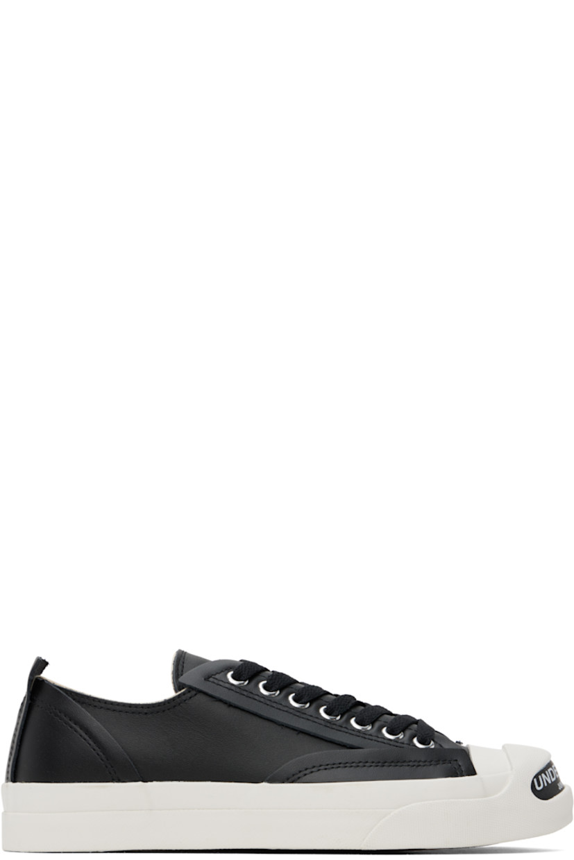 Low-top buffed leather sneakers in black.

· Logo printed at rubber cap toe 
· Lace-up closure
· Pull-tab at heel tab 
· Treaded rubber sole

Supplier color: Black