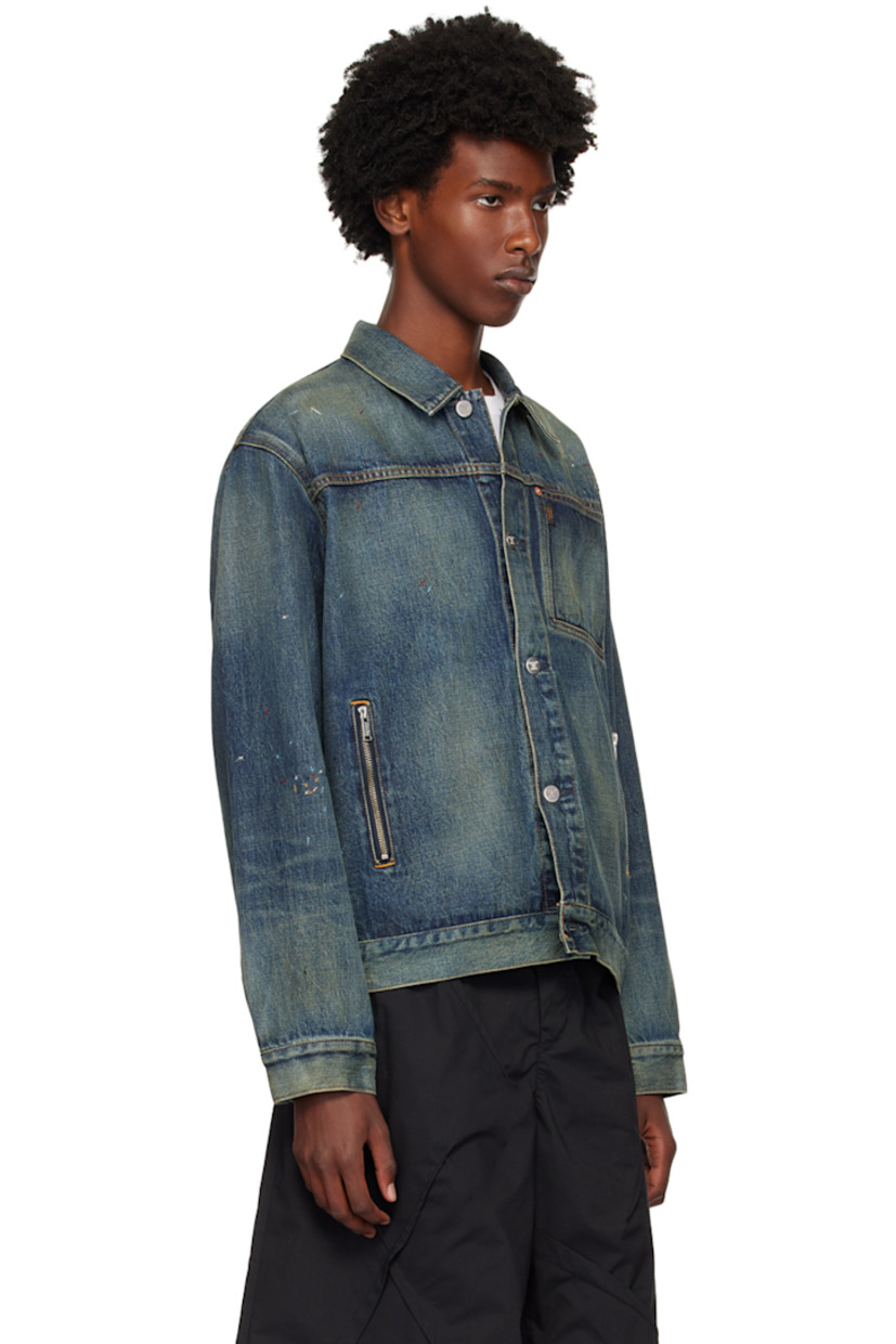 Non-stretch denim jacket. Fading, whiskering, and graphics embroidered throughout.

· Spread collar
· Button closure 
· Logo flag at chest
· Patch pocket and zip pockets
· Dropped shoulders
· Adjustable single-button barrel cuffs
· Adjustable button tabs at back hem
· Logo-engraved silver-tone hardware
· Contrast stitching in yellow

Supplier color: Light blue indigo