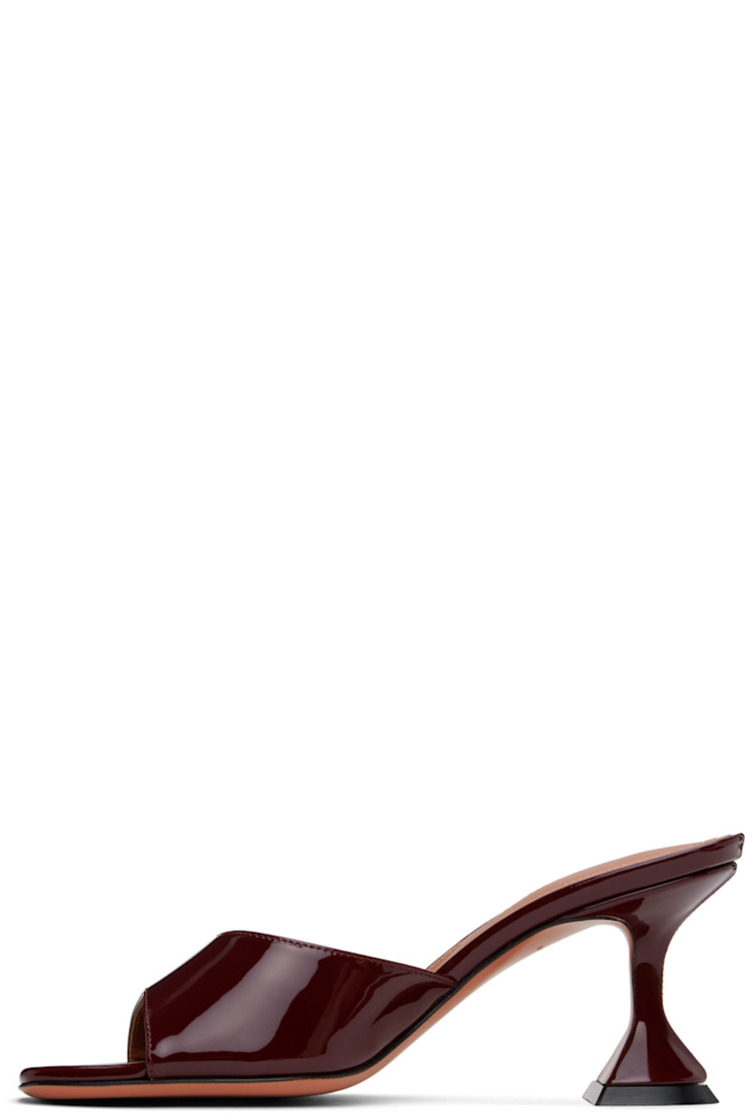 Patent leather heeled sandals in burgundy.

· Open square toe
· Logo embossed at padded leather footbed
· Covered spool heel with rubber injection
· Leather sole with rubber injection
· Heel: H2.75"

Supplier color: Wine
