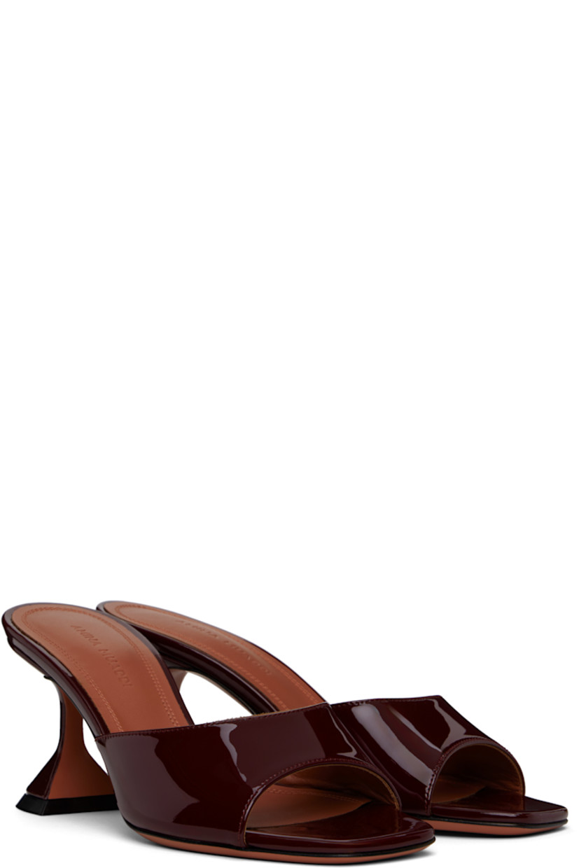 Patent leather heeled sandals in burgundy.

· Open square toe
· Logo embossed at padded leather footbed
· Covered spool heel with rubber injection
· Leather sole with rubber injection
· Heel: H2.75"

Supplier color: Wine