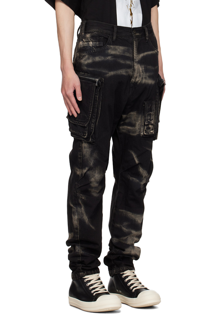 10 oz non-stretch denim cargo pants. Bleached effect throughout.

· Belt loops
· Seven-pocket styling
· Zip-fly
· Flap pocket at front
· Pleats at knees
· Zip cargo pocket at curved outseams

Supplier color: Black