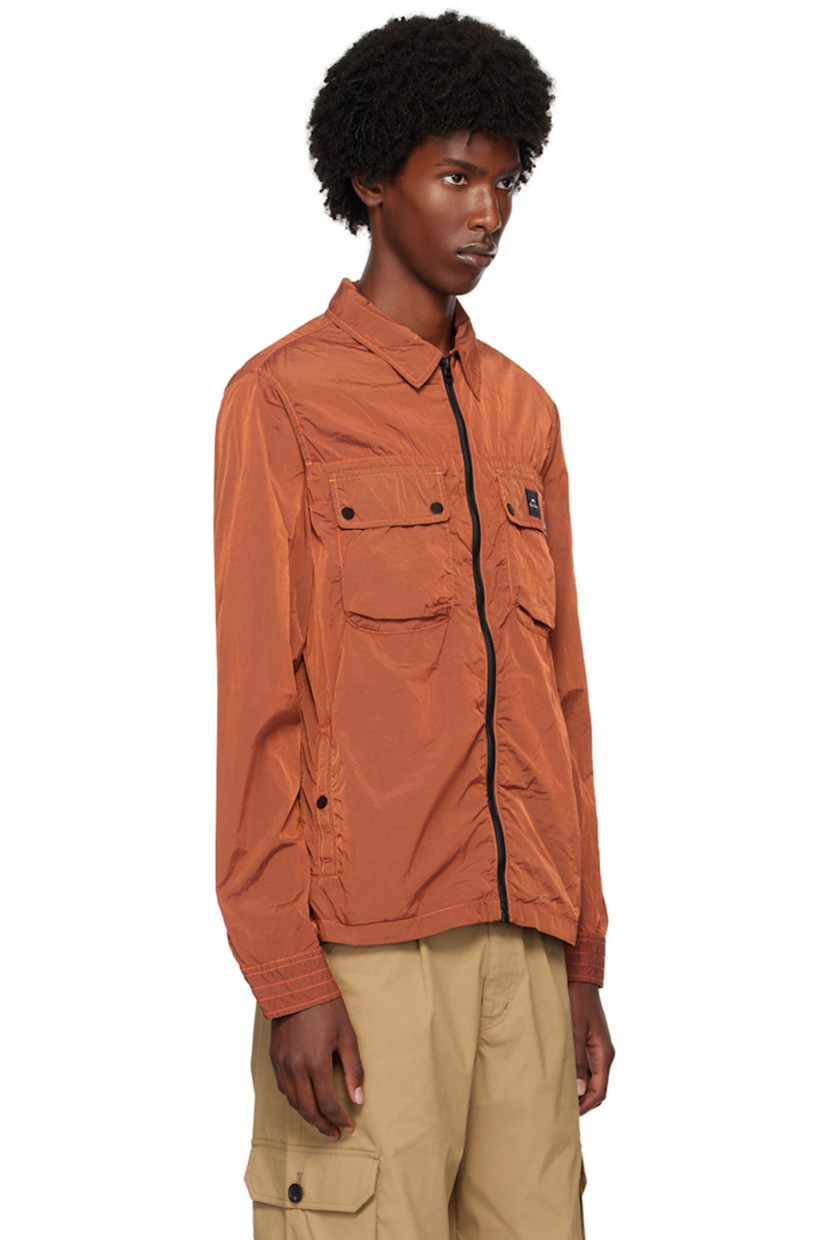 Recycled nylon taffeta jacket.

· Stand collar
· Zip closure  
· Flap and welt pockets at front
· Logo patch embroidered at chest 
· Press stud closure at barrel cuffs
· Contrast stitching in orange

Supplier color: Reds