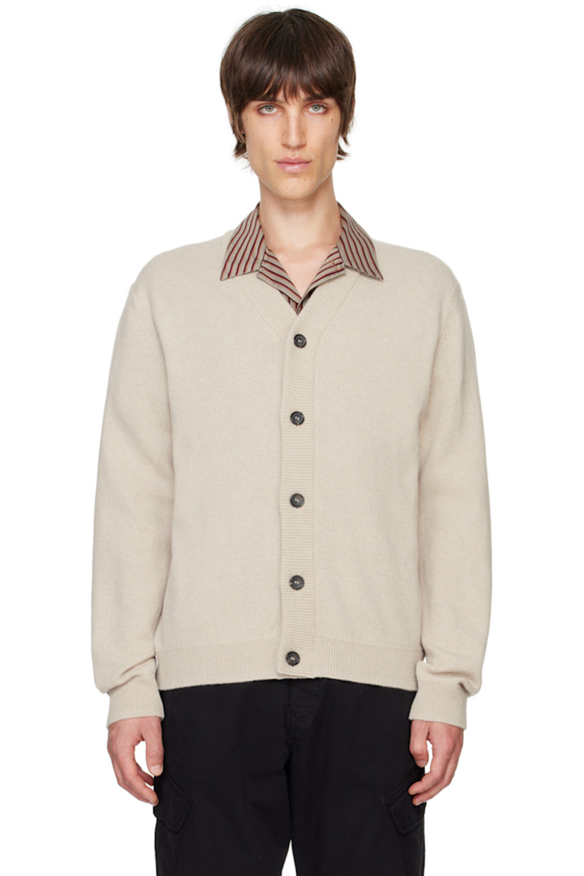 Knit GOTS-certified merino wool cardigan.

· Rib knit Y-neck, cuffs, and hem
· Button closure
· Striped grosgrain loop at back collar

Supplier color: Ecru