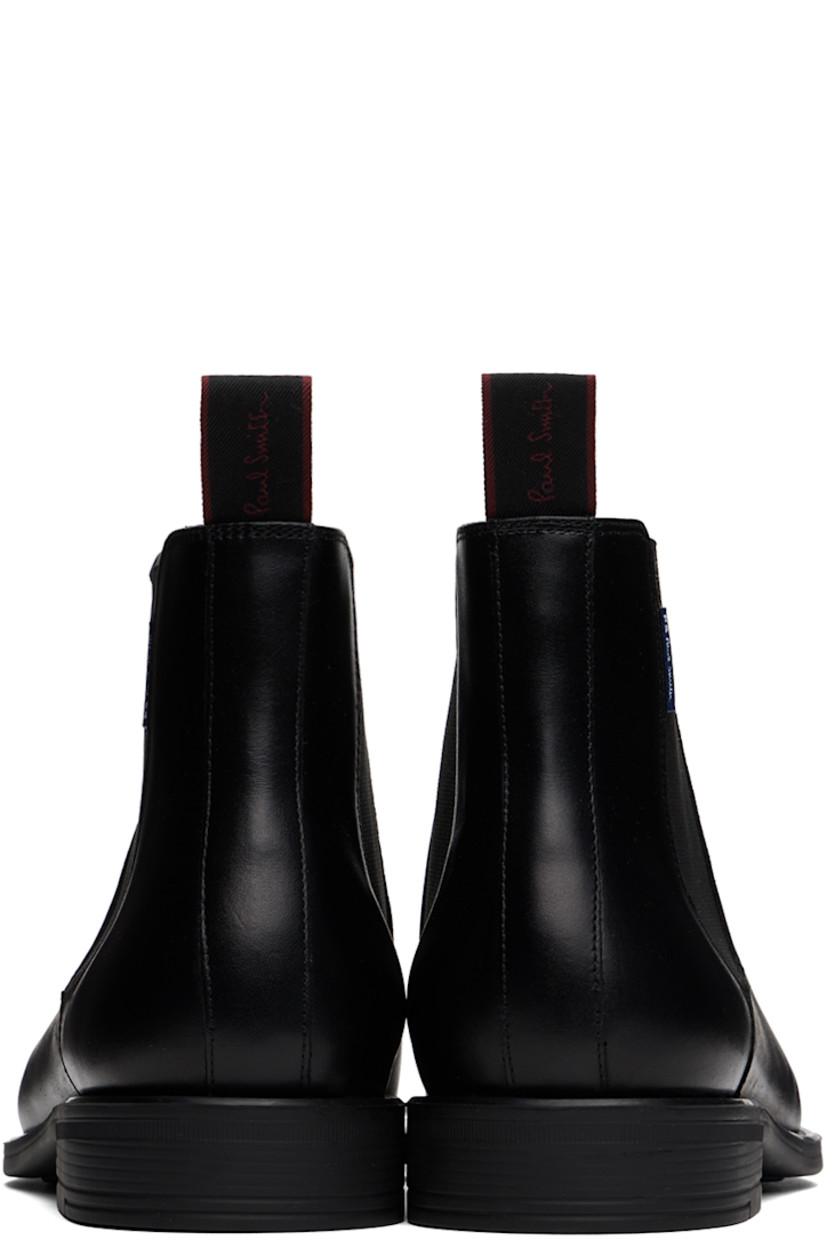 Ankle-high buffed leather Chelsea boots in black.

· Logo flag at outer side
· Elasticized gusset at sides
· Logo-woven pull-loop at heel collar
· Grained leather and suede lining
· Logo stamp at padded leather footbed
· Rubber block heel
· Treaded rubber sole

Supplier color: Black