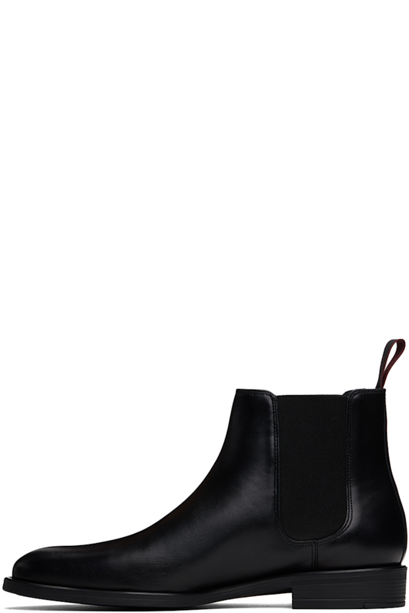 Ankle-high buffed leather Chelsea boots in black.

· Logo flag at outer side
· Elasticized gusset at sides
· Logo-woven pull-loop at heel collar
· Grained leather and suede lining
· Logo stamp at padded leather footbed
· Rubber block heel
· Treaded rubber sole

Supplier color: Black