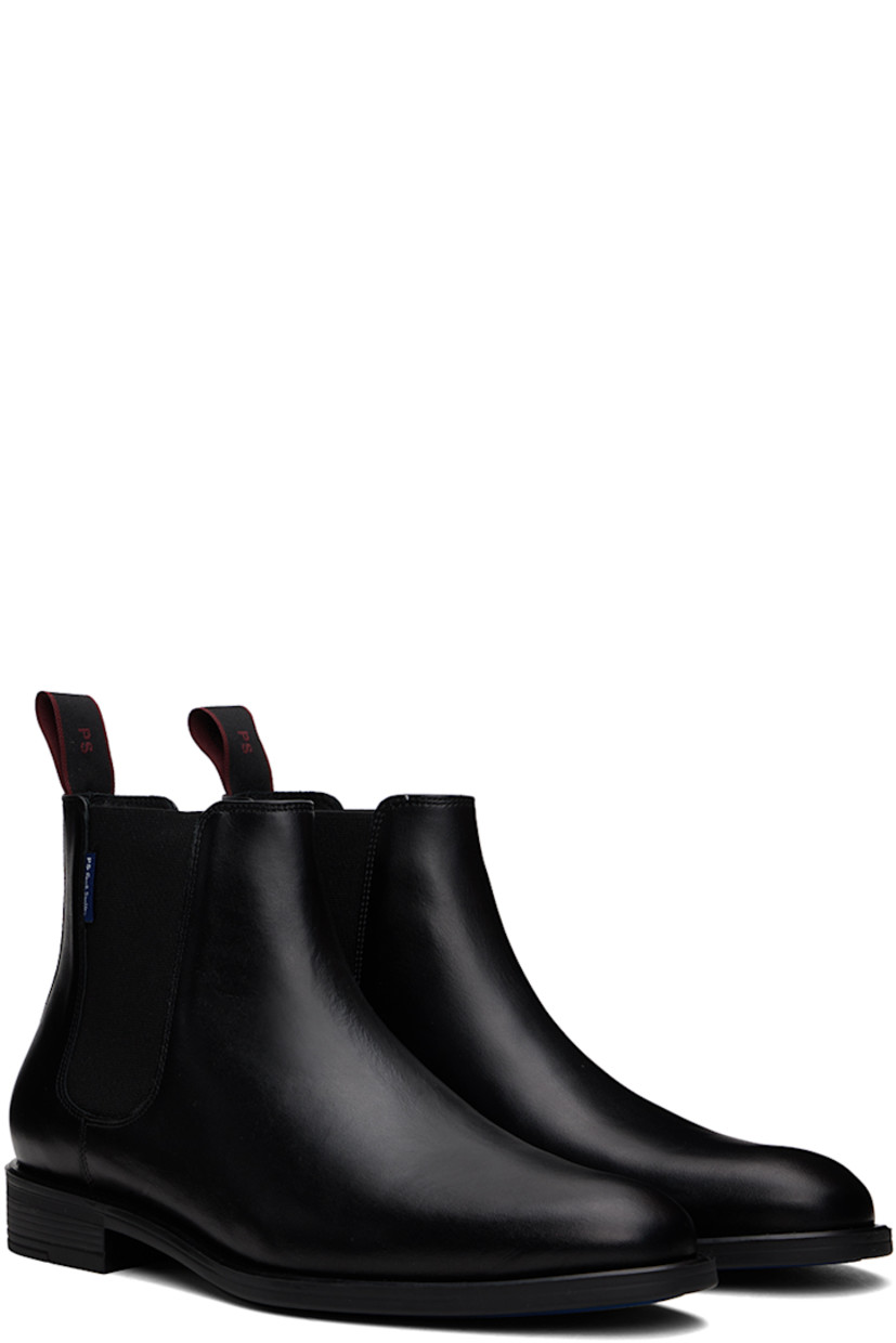 Ankle-high buffed leather Chelsea boots in black.

· Logo flag at outer side
· Elasticized gusset at sides
· Logo-woven pull-loop at heel collar
· Grained leather and suede lining
· Logo stamp at padded leather footbed
· Rubber block heel
· Treaded rubber sole

Supplier color: Black