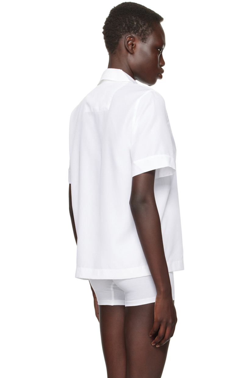 Breathable Tencel™ lyocell poplin pyjama shirt.

· Open spread collar
· Button closure
· Patch pocket at chest
· Mother-of-pearl hardware

Supplier color: White