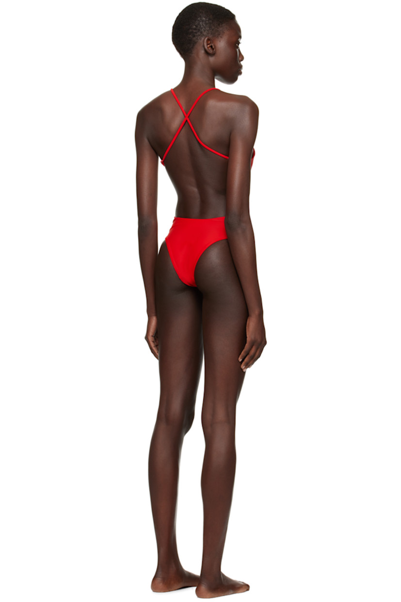 Stretch ECONYL® recycled nylon jersey swimsuit. 

· Scoop neck
· Adjustable criss-crossing shoulder straps
· Open back
· Fully lined

Supplier color: Poppy red