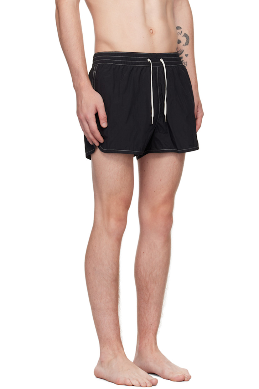 Quick-drying ECONYL® regenerated nylon twill swim shorts.

· Drawstring at elasticized waistband
· Three-pocket styling
· Engraved grommets at back waist
· Vented side seams
· Full mesh lining
· Contrast stitching in white

Supplier color: Black