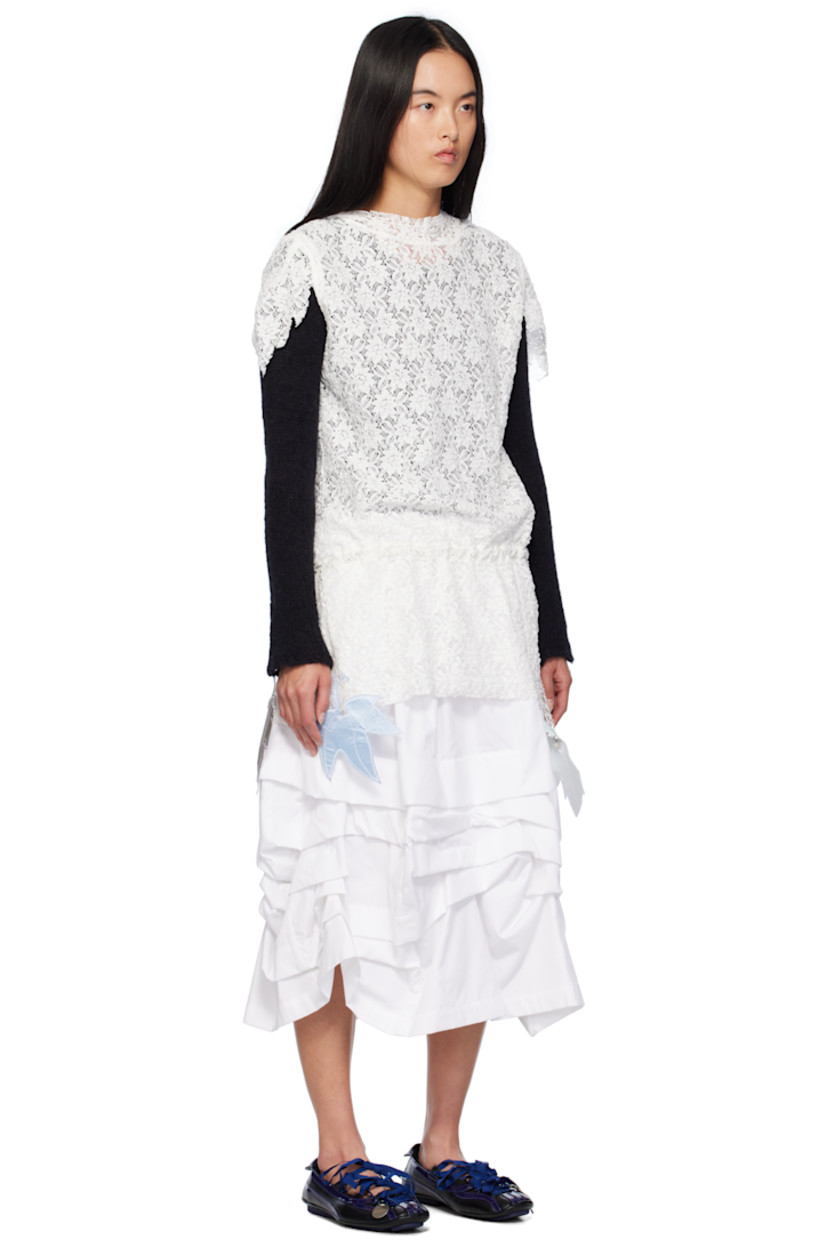 Semi-sheer cotton- and polyester-blend lace minidress. 

· Extended trim at hood
· Asymmetric trim at sleeves
· Logo pins and drawstring at drop waist
· Asymmetric hem
· Unlined

Supplier color: White lace