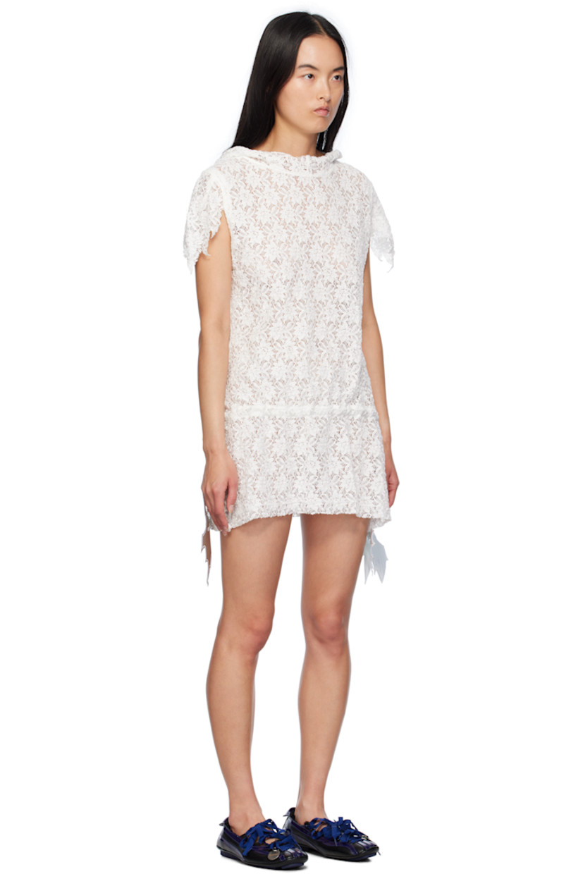 Semi-sheer cotton- and polyester-blend lace minidress. 

· Extended trim at hood
· Asymmetric trim at sleeves
· Logo pins and drawstring at drop waist
· Asymmetric hem
· Unlined

Supplier color: White lace