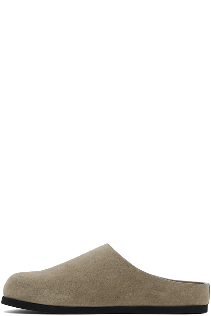 Suede slip-on loafers in taupe.

· Signature series embossed at outer side
· Logo stamp at molded suede footbed
· Buffed leather lining
· Rubber sole

Supplier color: Taupe