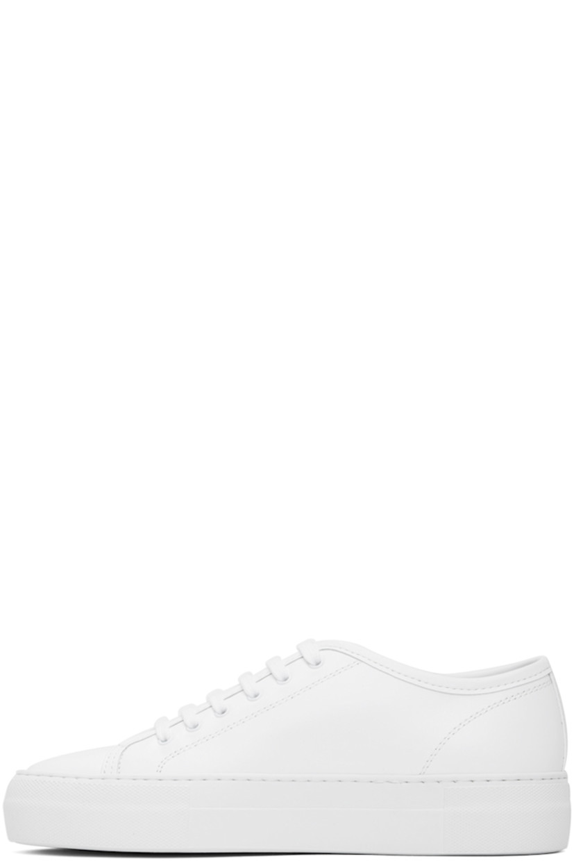 Low-top buffed leather sneakers in white. 

· Lace-up closure
· Signature series stamp at outer side
· Grained leather and suede lining
· Textured rubber platform midsole
· Treaded rubber sole
· Platform: H1.25"

Supplier color: White