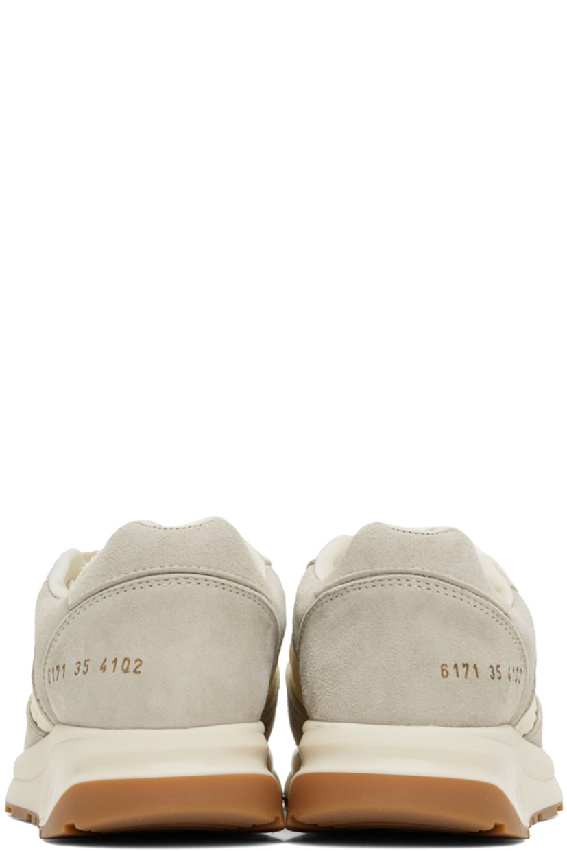 Low-top suede and quilted taffeta sneakers in off-white.

· Lace-up closure
· Padded tongue and collar
· Signature series stamp at outer side
· Grained leather and suede lining
· Sculptural foam rubber midsole
· Treaded rubber sole

Supplier color: Off white