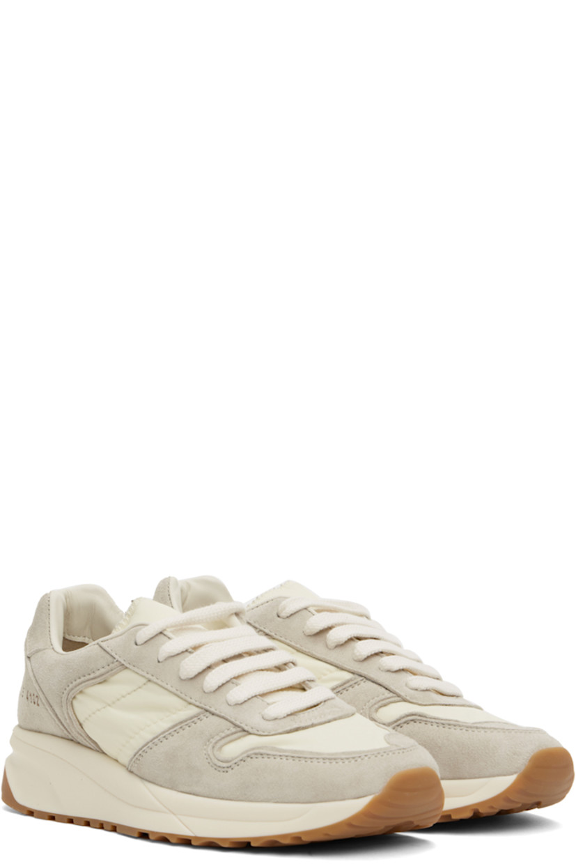 Low-top suede and quilted taffeta sneakers in off-white.

· Lace-up closure
· Padded tongue and collar
· Signature series stamp at outer side
· Grained leather and suede lining
· Sculptural foam rubber midsole
· Treaded rubber sole

Supplier color: Off white