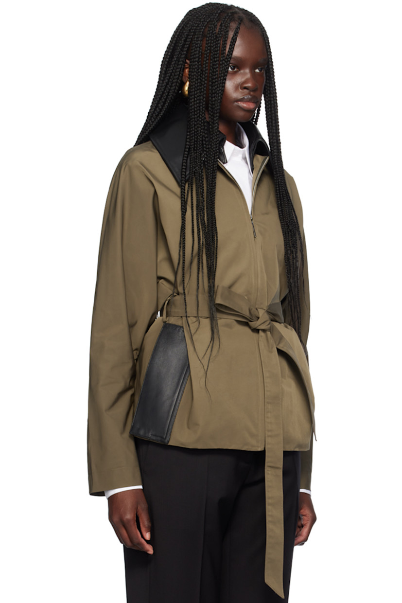 Loose-fit polyester taslan jacket. Grained leather trim throughout.

· Water-repellent
· Spread collar
· Zip closure
· Detachable self-tie belt at waist
· Seam pockets
· Dolman sleeves
· Inverted box pleats at back
· Full viscose tricot lining

Supplier color: Cachi