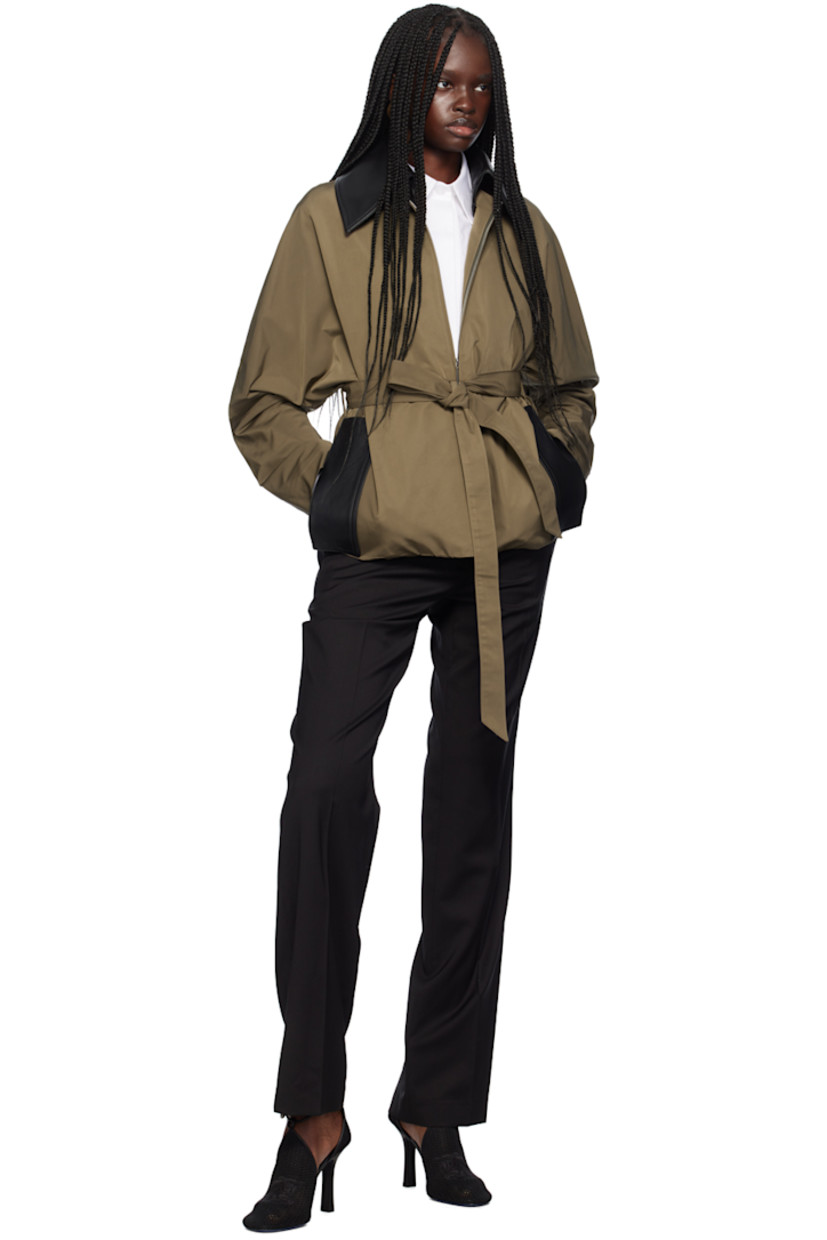 Loose-fit polyester taslan jacket. Grained leather trim throughout.

· Water-repellent
· Spread collar
· Zip closure
· Detachable self-tie belt at waist
· Seam pockets
· Dolman sleeves
· Inverted box pleats at back
· Full viscose tricot lining

Supplier color: Cachi