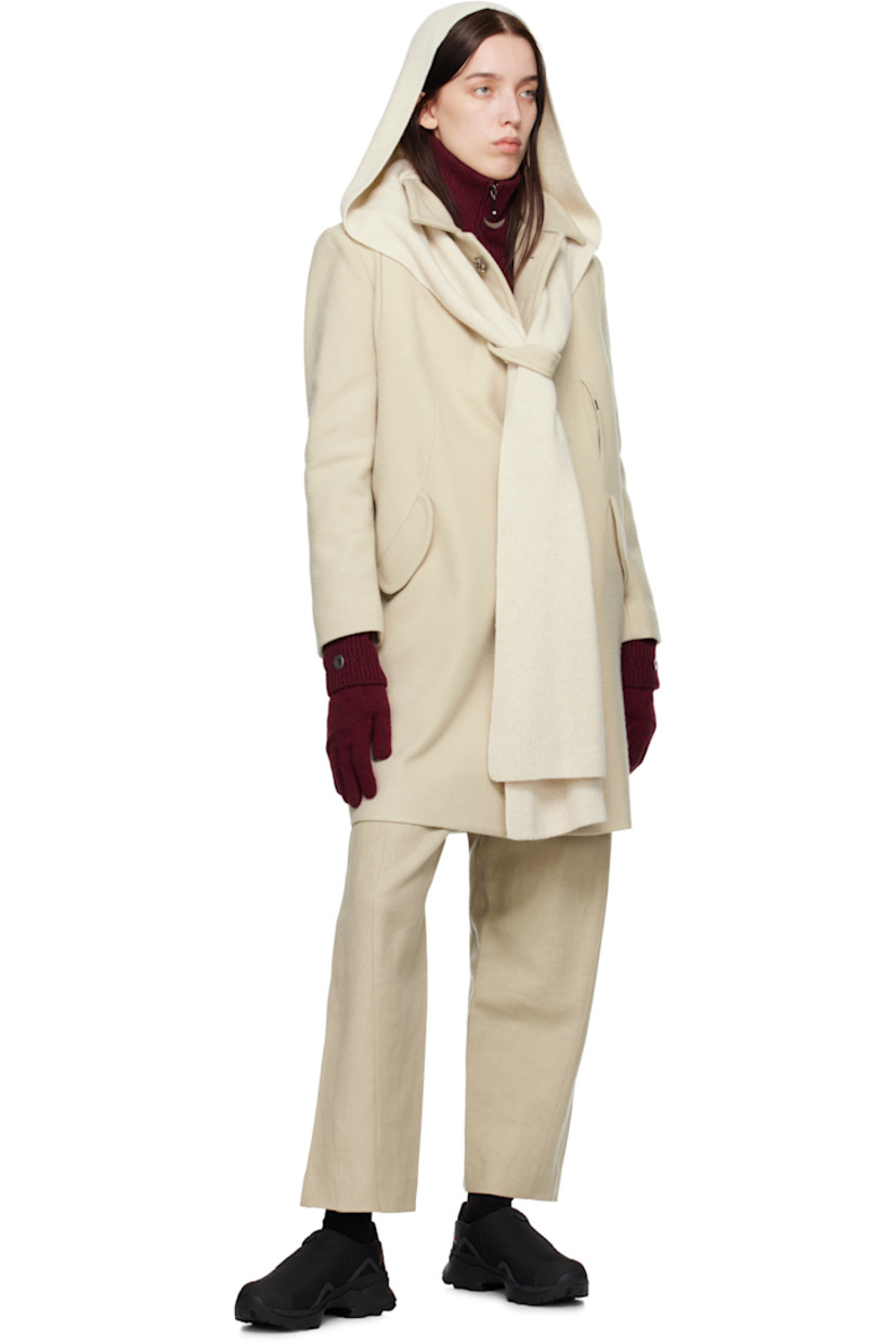 Wool-blend melton coat. 

· Paneled construction
· Scarf-style trim at detachable rib-knit hood
· Spread collar 
· Graphic ceramic hardware at concealed button closure 
· Logo plaque and keeper loop at front
· Patch pocket and flap pockets
· Concealed zip pocket at armscye
· Central vent at back hem
· Partial satin lining

Supplier color: Ivory
