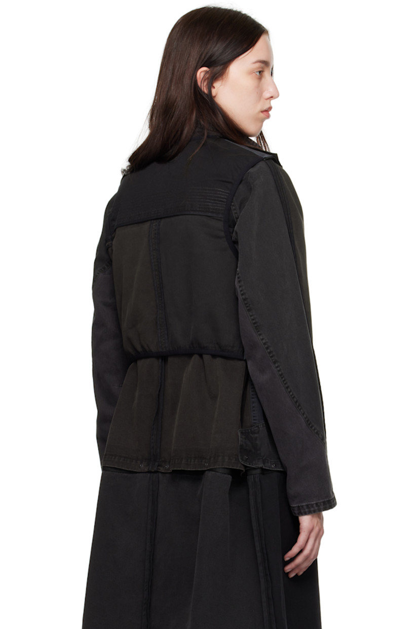 Reversible cotton twill vest. Topstitching, webbing trim, and press-stud fastenings throughout. 

Reverse in khaki virgin wool flannel. Webbing trim throughout. 

· Layered construction 
· Detachable panel at front 
· Round neck 
· Pen slots at chest
· Zip pocket and flap pocket at front 
· Press-stud fastening at side seams
· Asymmetric curved hem
· Logo-engraved silver-tone hardware 

Supplier color: Stone